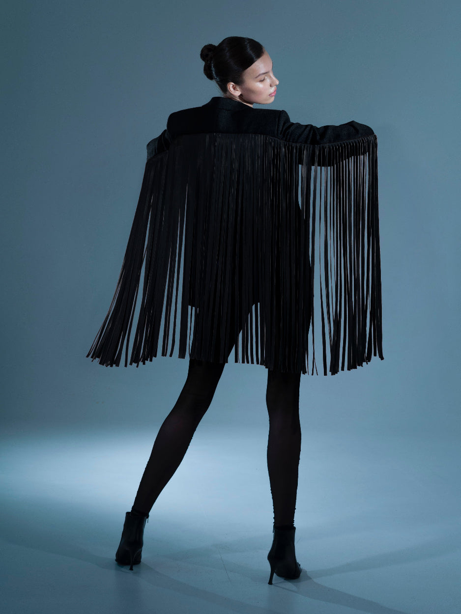 UPCYCLED JACKET WITH FRINGE with a man's shoulder