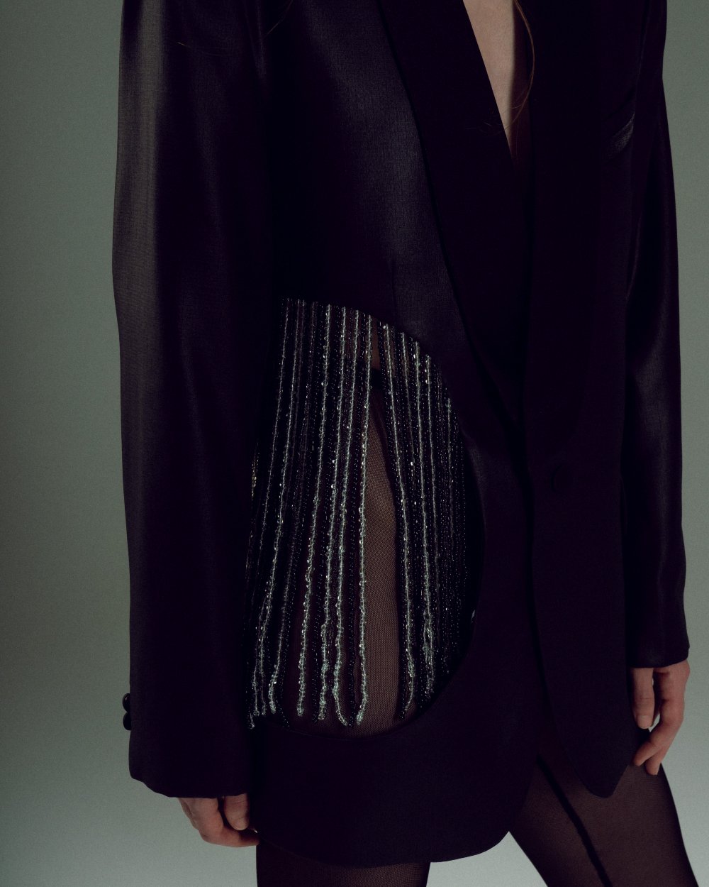 BEADED UPCYCLED JACKET with a man's shoulder